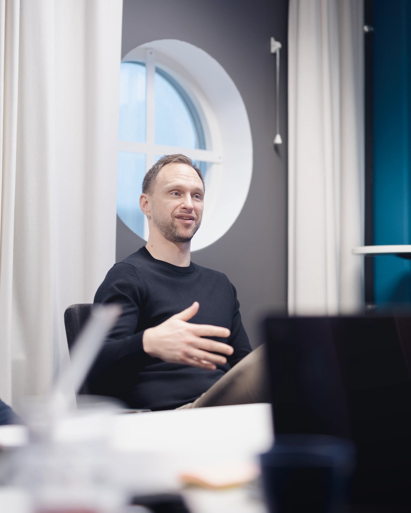 A picture of Andrej, TeQflo's COO sitting in a meeting at TeQflo's office