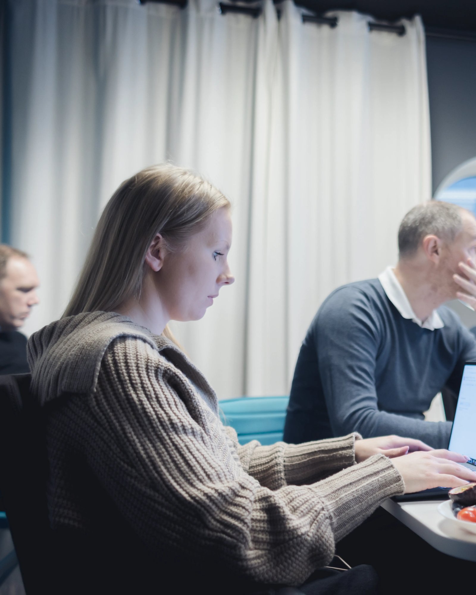 A picture of Madeleine having a meeting in one of TeQflo's meeting rooms