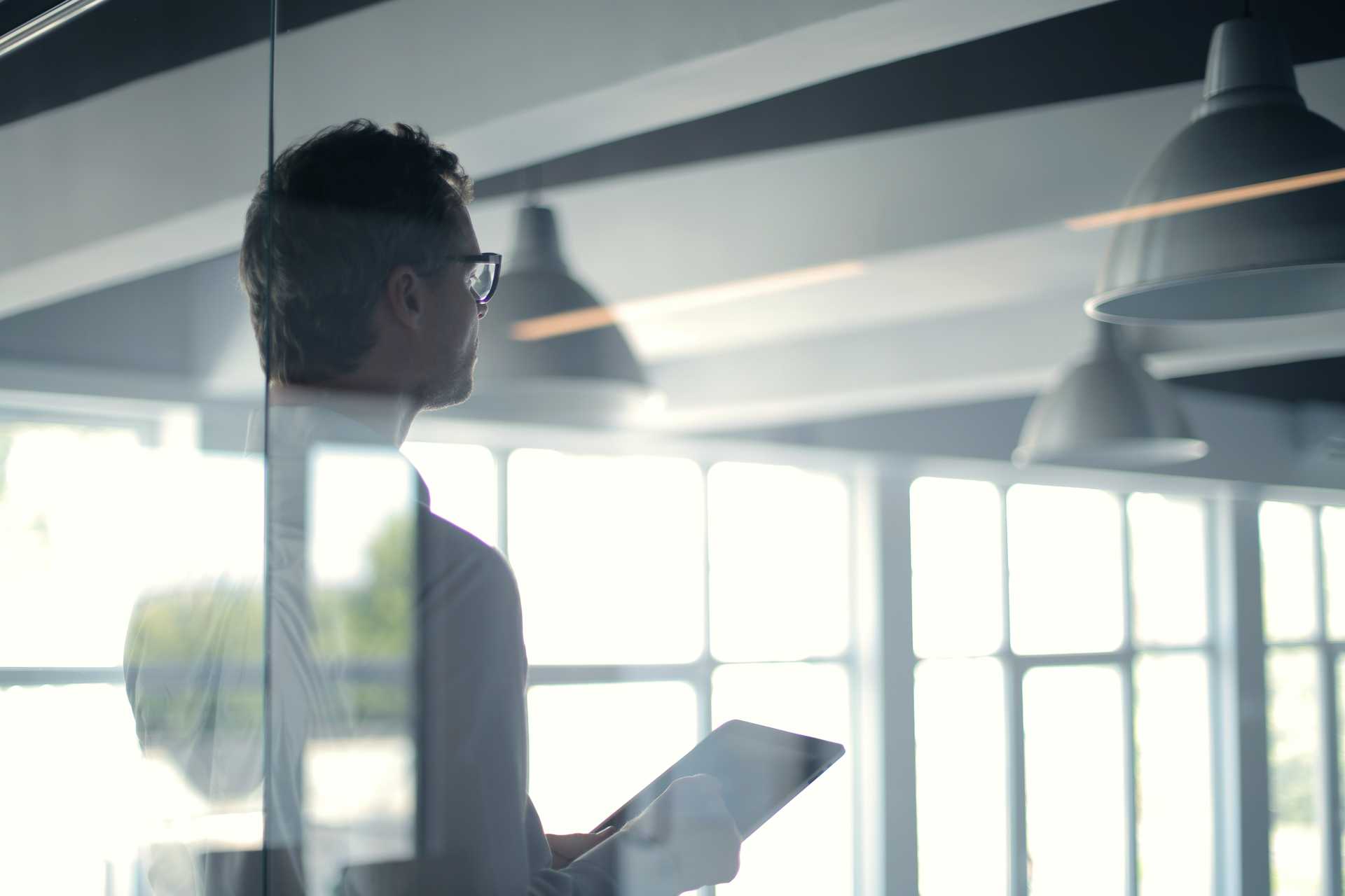 formal-man-with-tablet-giving-presentation-in-office-3760093 (1) (1)