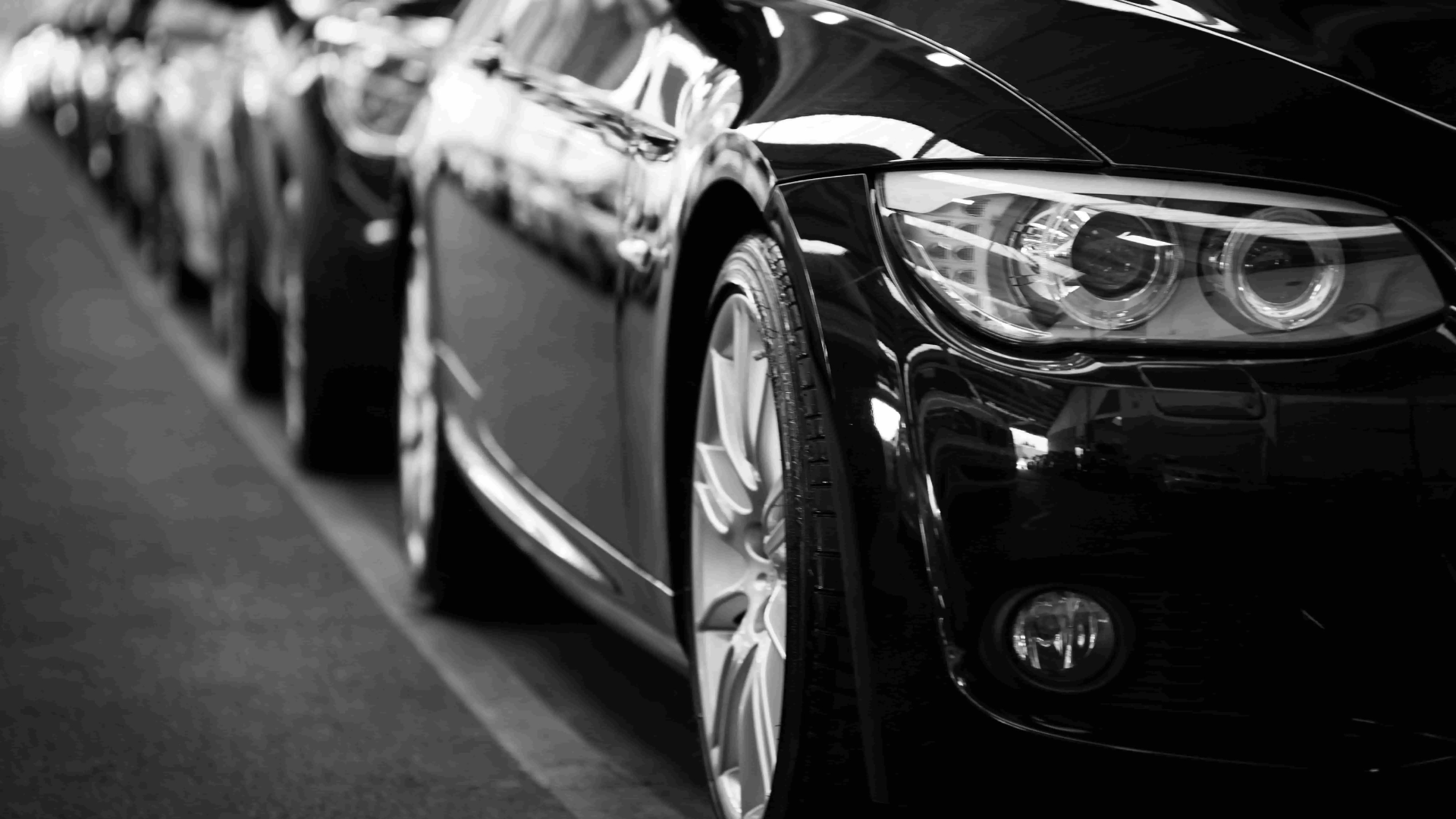 A black and white picture of cars.