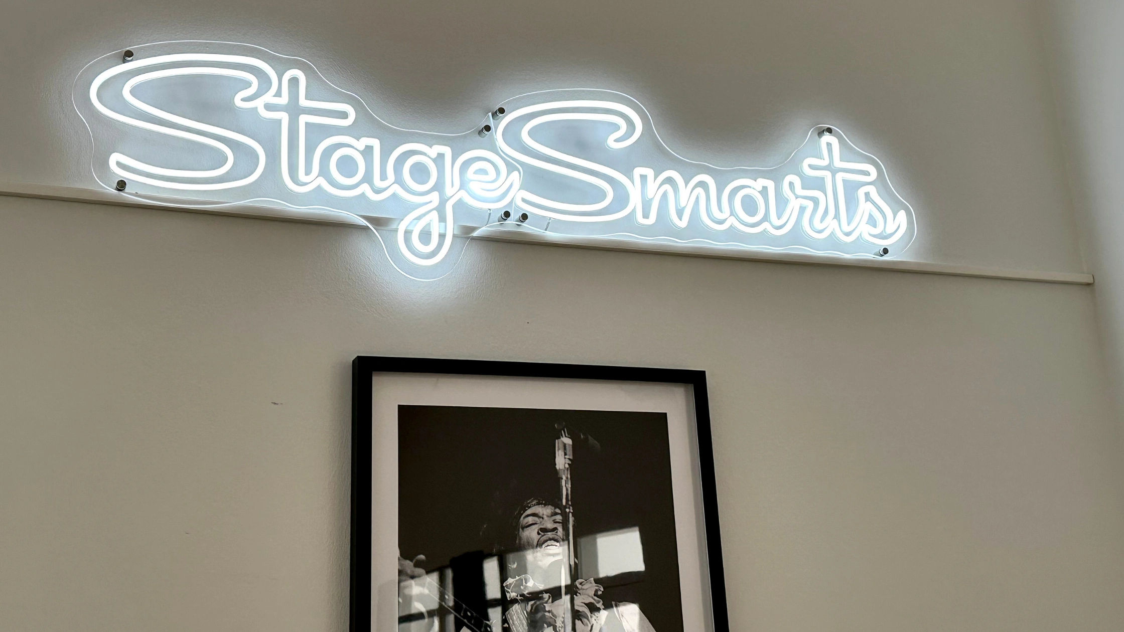 An image featuring the StageSmarts logo and a framed portrait of Jimi Hendrix